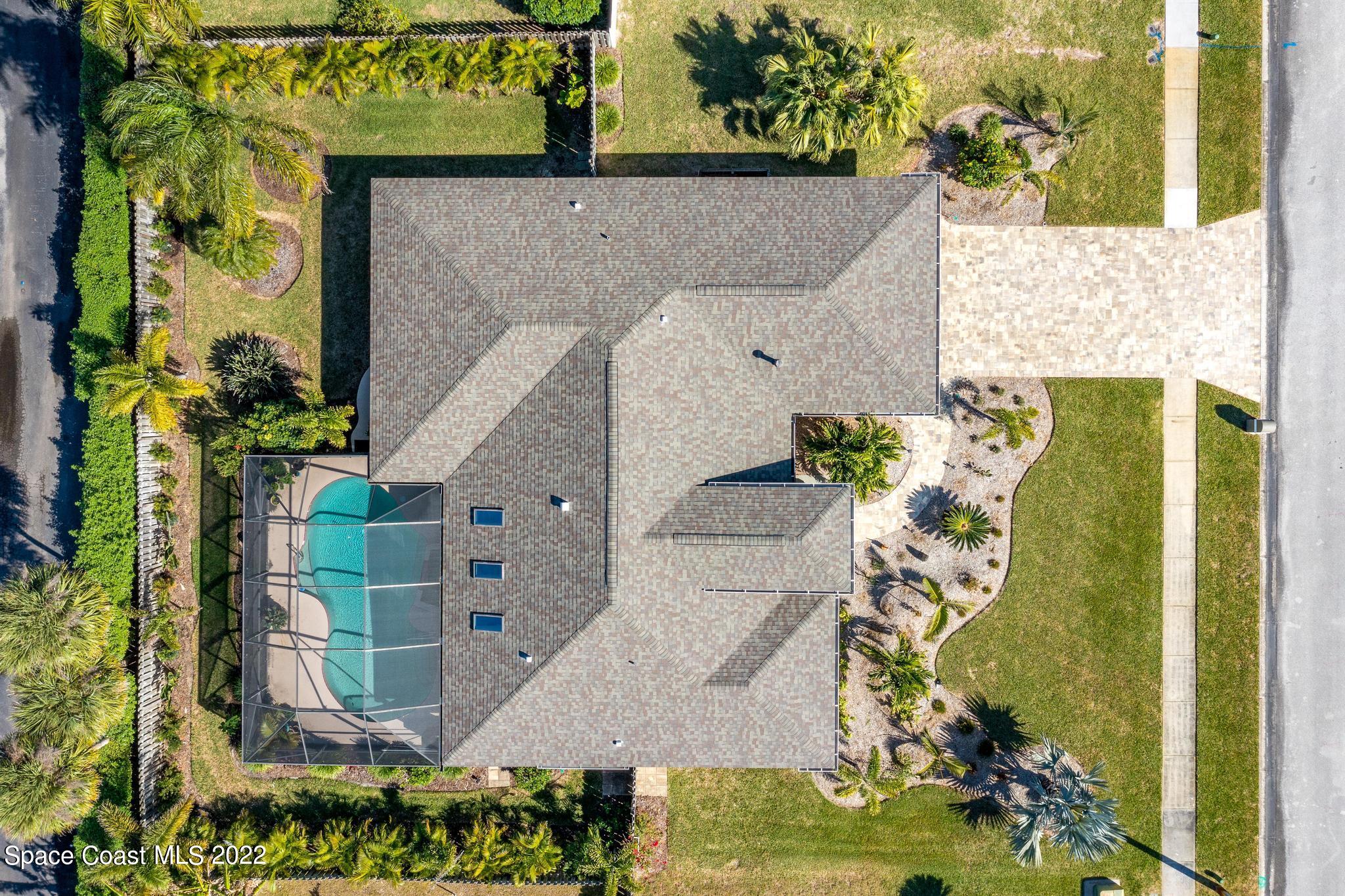 470 Veracruz Boulevard Indialantic, FL 32903 - Photo 24 of 25 aerial view of a house with a yard