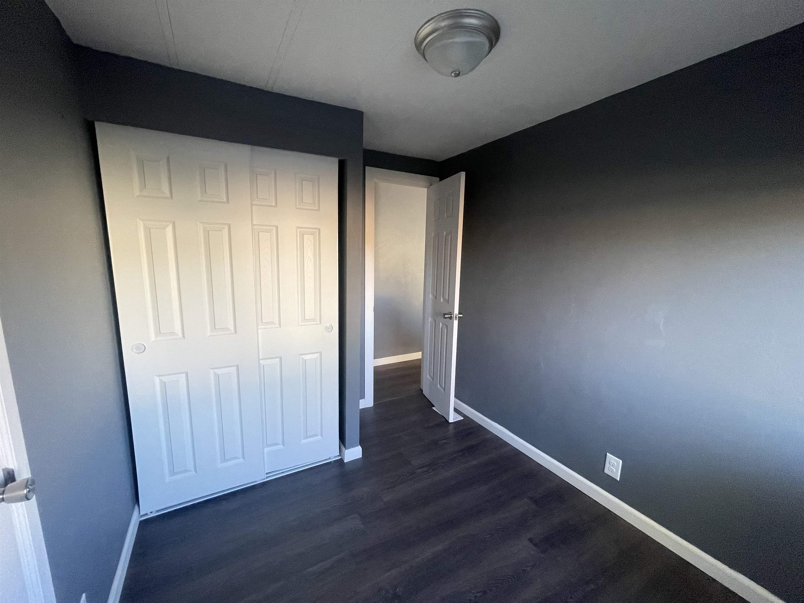 420 Pisces Circle Fruita, CO 81521 - Photo 12 of 12 an empty room with wooden floor