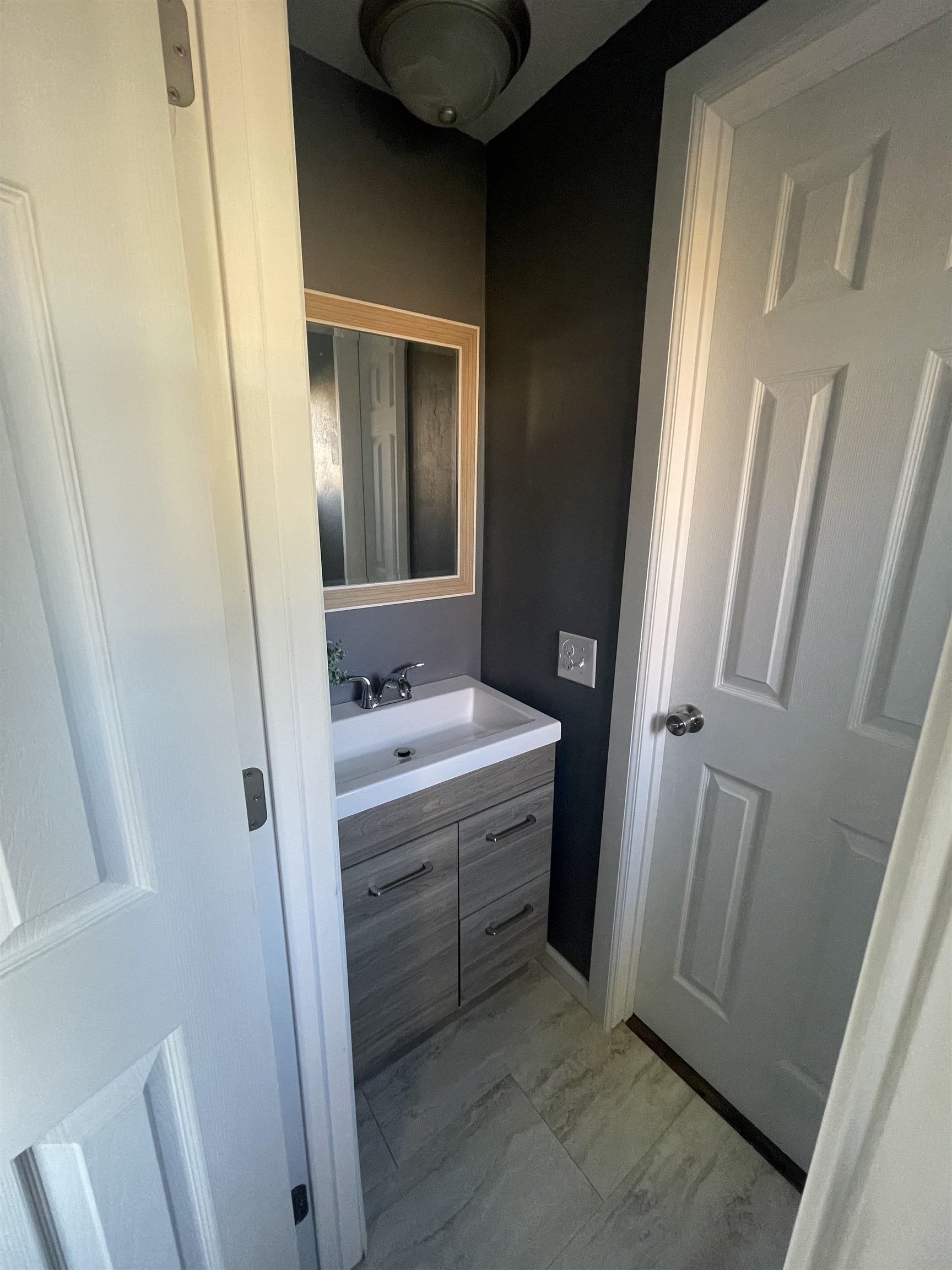 420 Pisces Circle Fruita, CO 81521 - Photo 7 of 12 a bathroom with a sink and mirror with bathtub