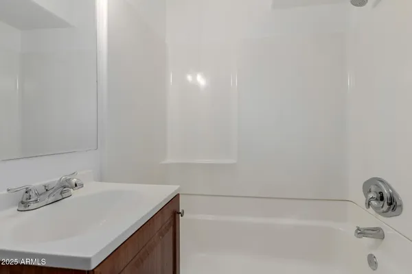 a bathroom with a sink and a bathtub