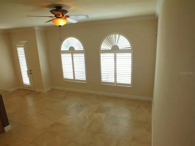 a view of empty room with windows