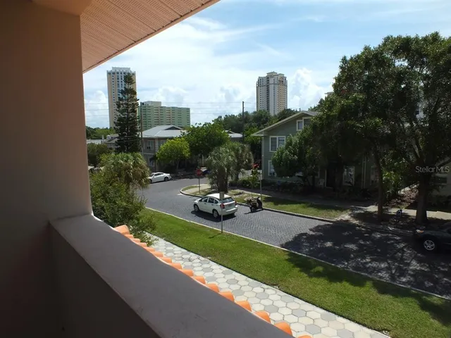 a view of a garden with sitting area