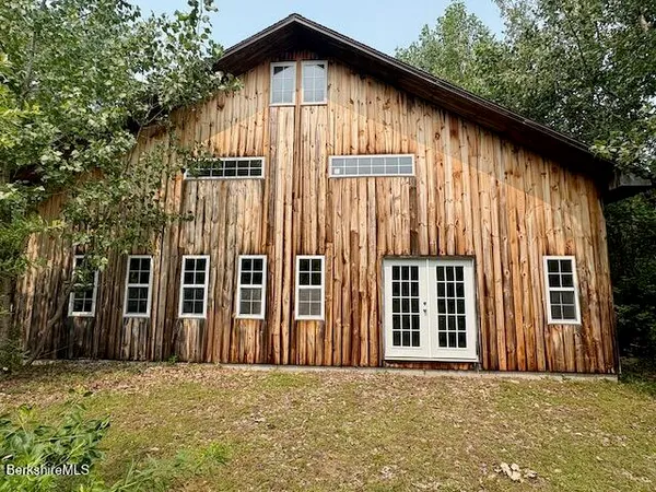 a front view of a house with a outdoor space
