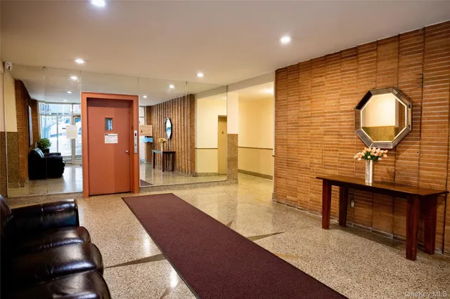 a view of a hallway with seating area