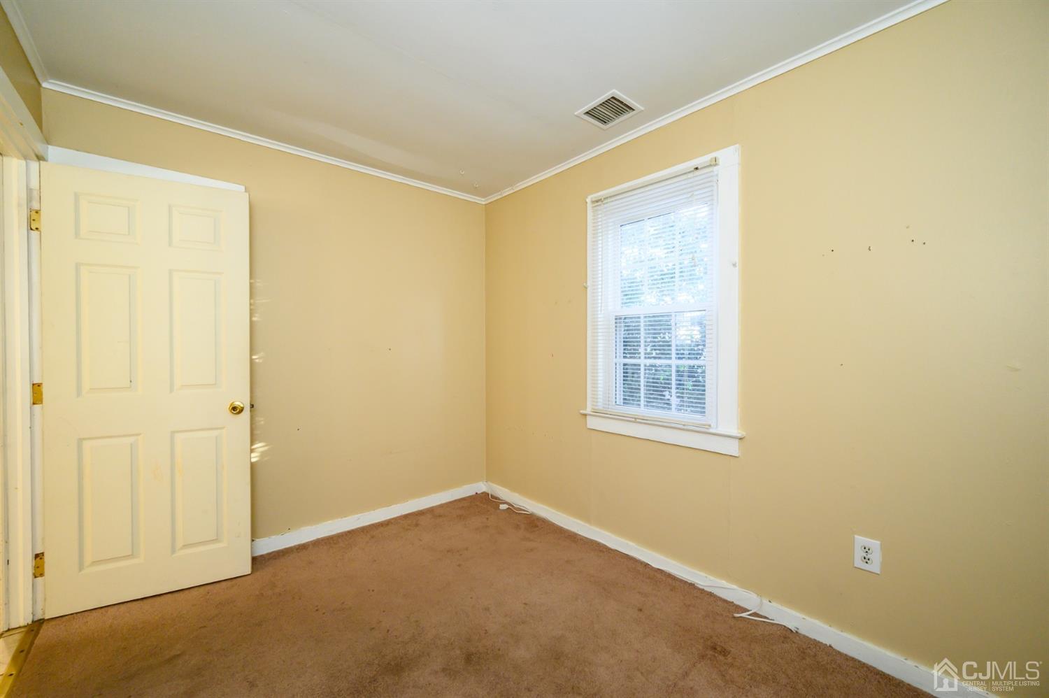 11 Holly Road Brick, NJ 08723 - Photo 17 of 28 a view of an empty room with a window