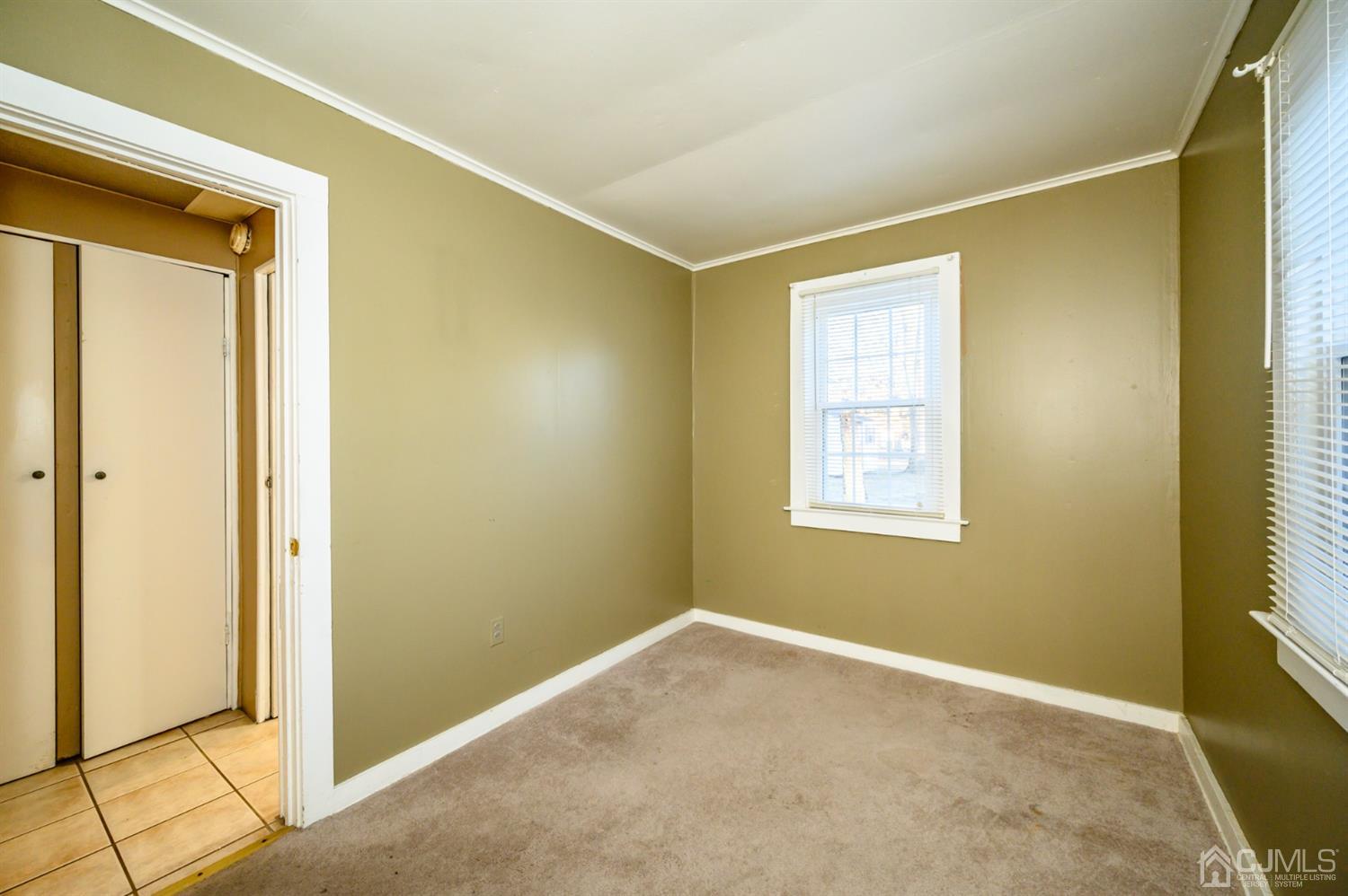 11 Holly Road Brick, NJ 08723 - Photo 20 of 28 a view of an empty room with a window