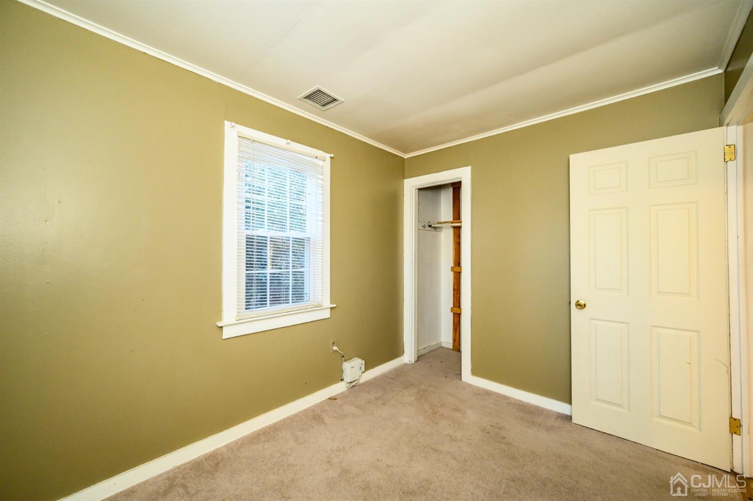 11 Holly Road Brick, NJ 08723 - Photo 22 of 28 an empty room with windows
