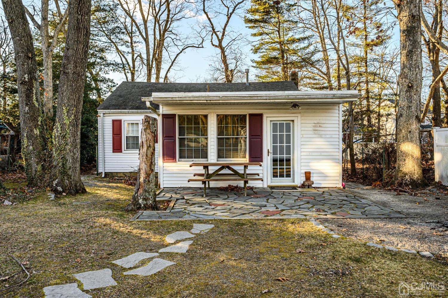11 Holly Road Brick, NJ 08723 - Photo 24 of 28 a backyard of a house with yard and outdoor seating