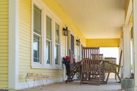 a view of front door and potted plants