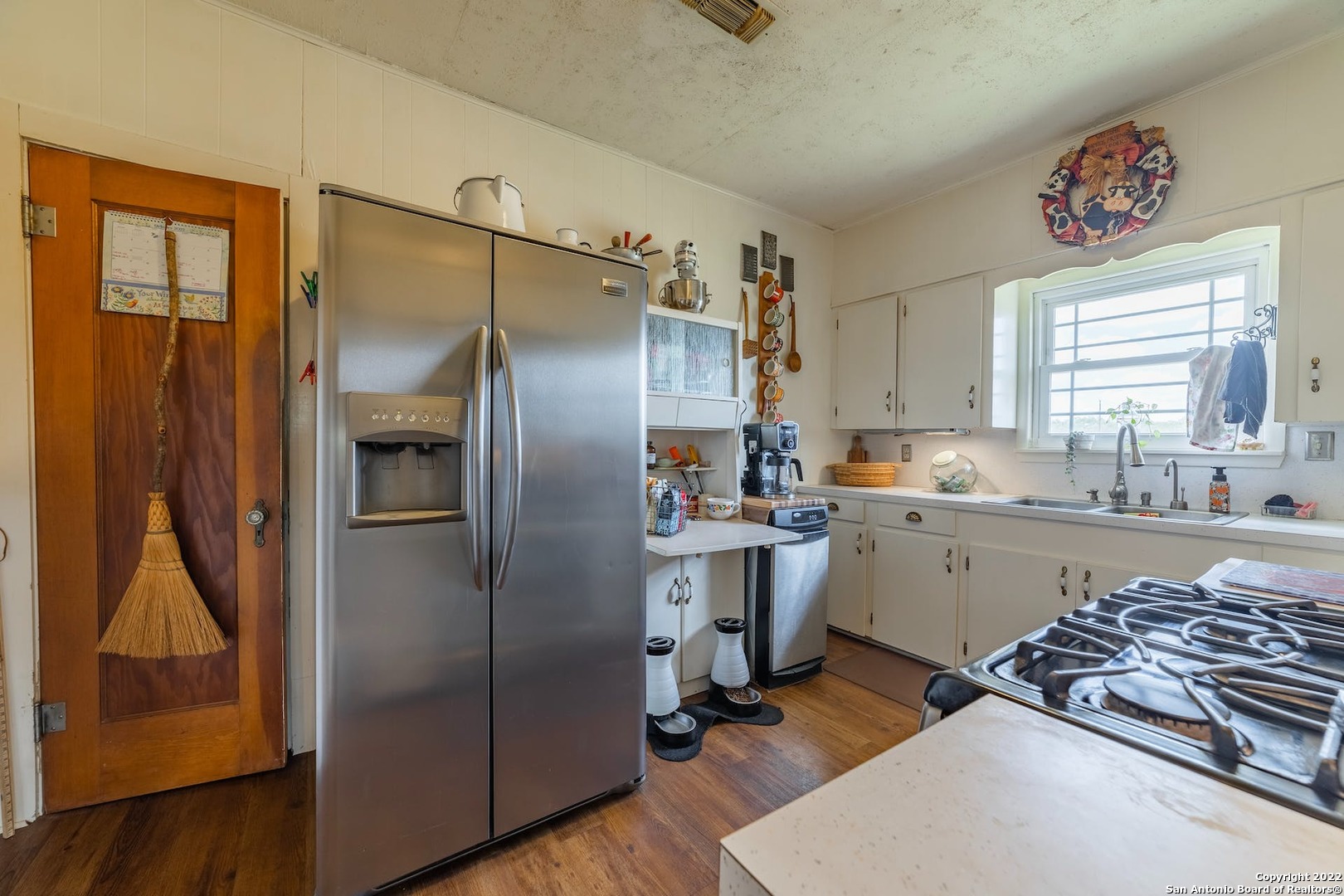 11801 Jim Terrill Road Adkins, TX 78101 - Photo 11 of 46 a kitchen with a sink stainless steel appliances and a window