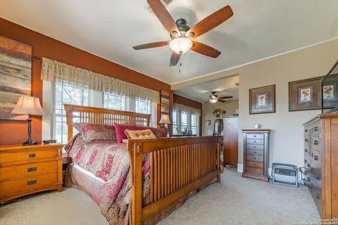 a bedroom with furniture and windows