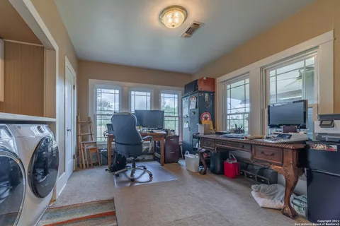a view of a livingroom with furniture and a livingroom