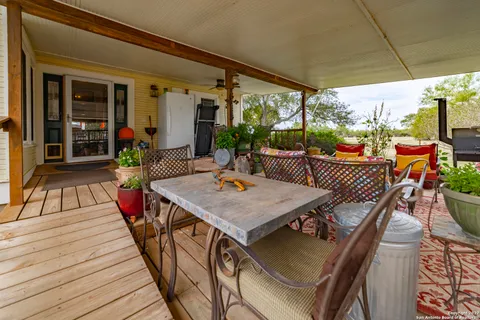 a view of an outdoor dining space with furniture