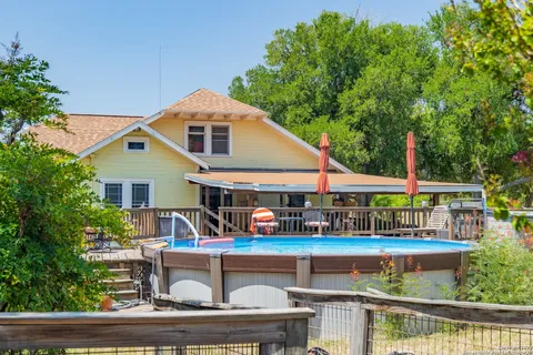 a view of a swimming pool with an outdoor seating