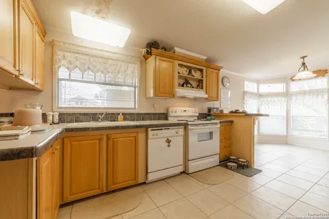 a spacious bathroom with a double vanity sink and a mirror