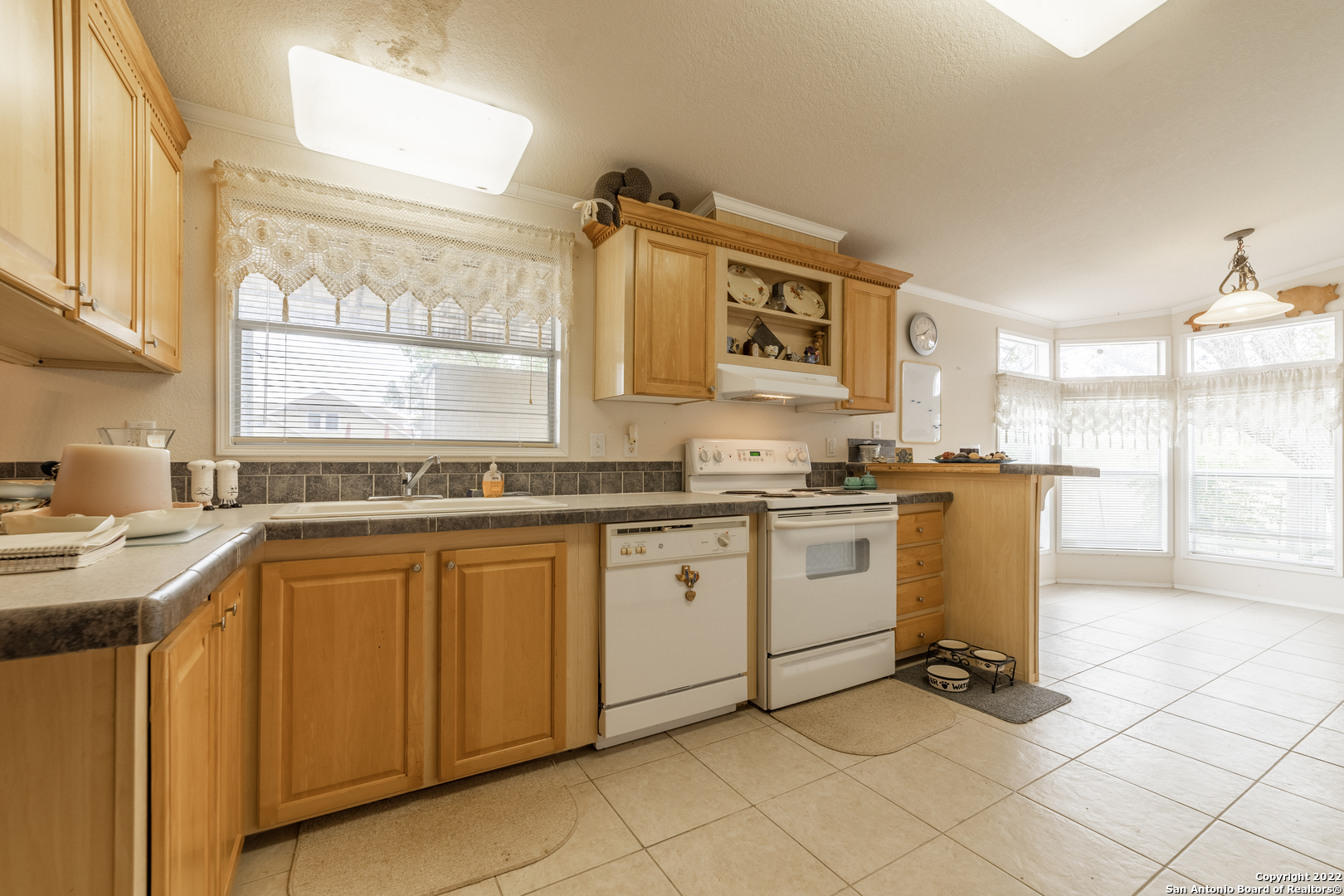 11801 Jim Terrill Road Adkins, TX 78101 - Photo 41 of 46 a kitchen with a sink cabinets and window