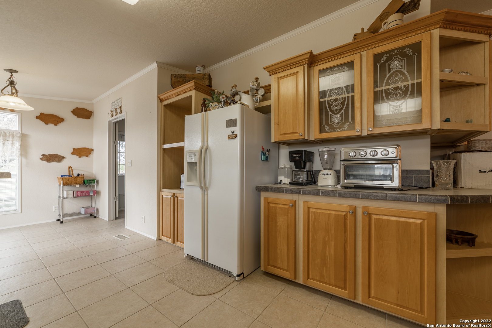 11801 Jim Terrill Road Adkins, TX 78101 - Photo 42 of 46 a kitchen with stainless steel appliances granite countertop a refrigerator and a stove