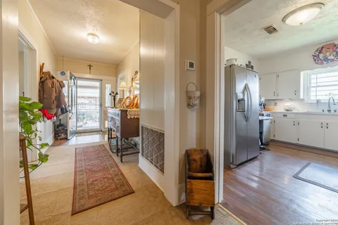 a view of a living room and a wooden floor