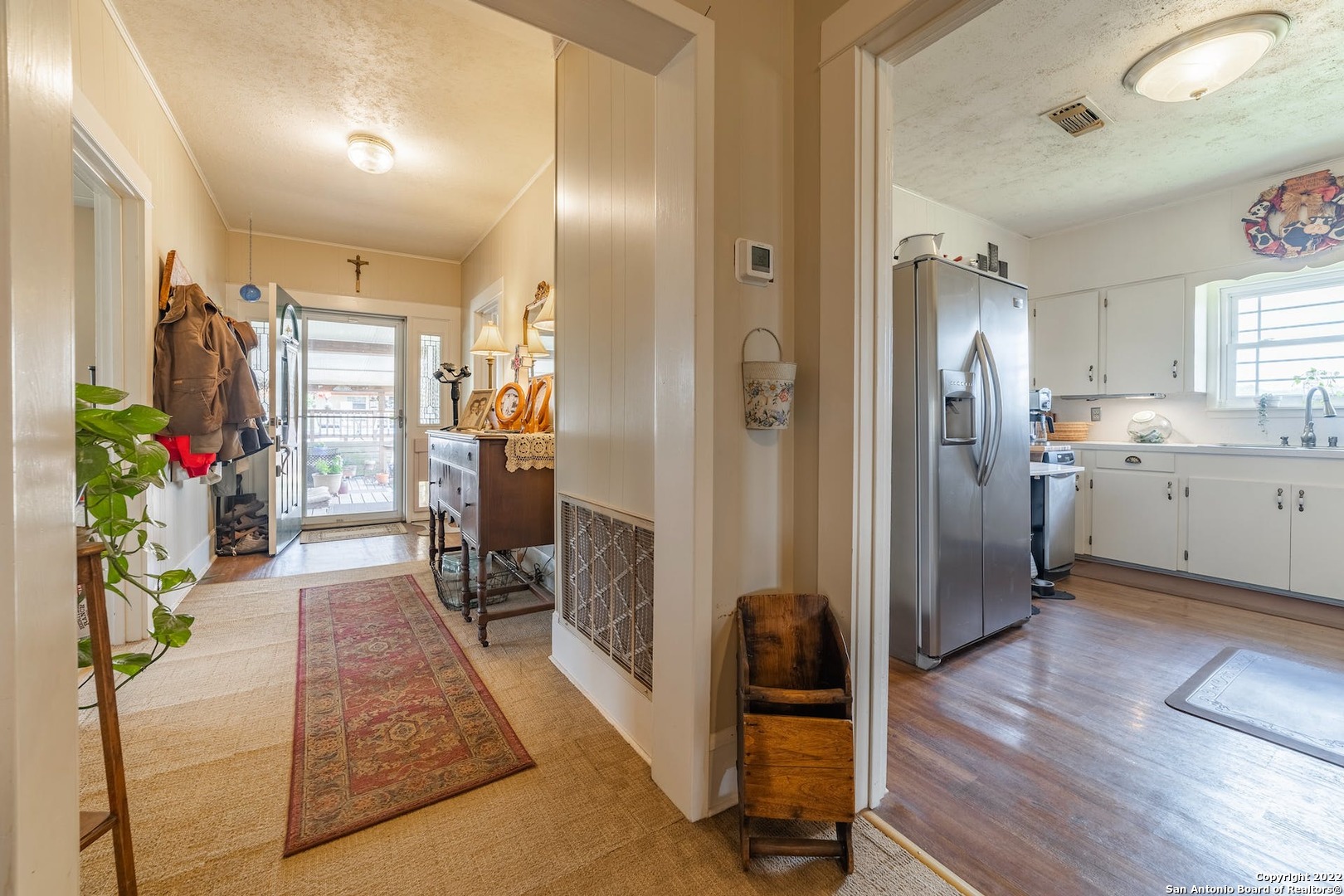 11801 Jim Terrill Road Adkins, TX 78101 - Photo 9 of 46 a view of a living room and a wooden floor