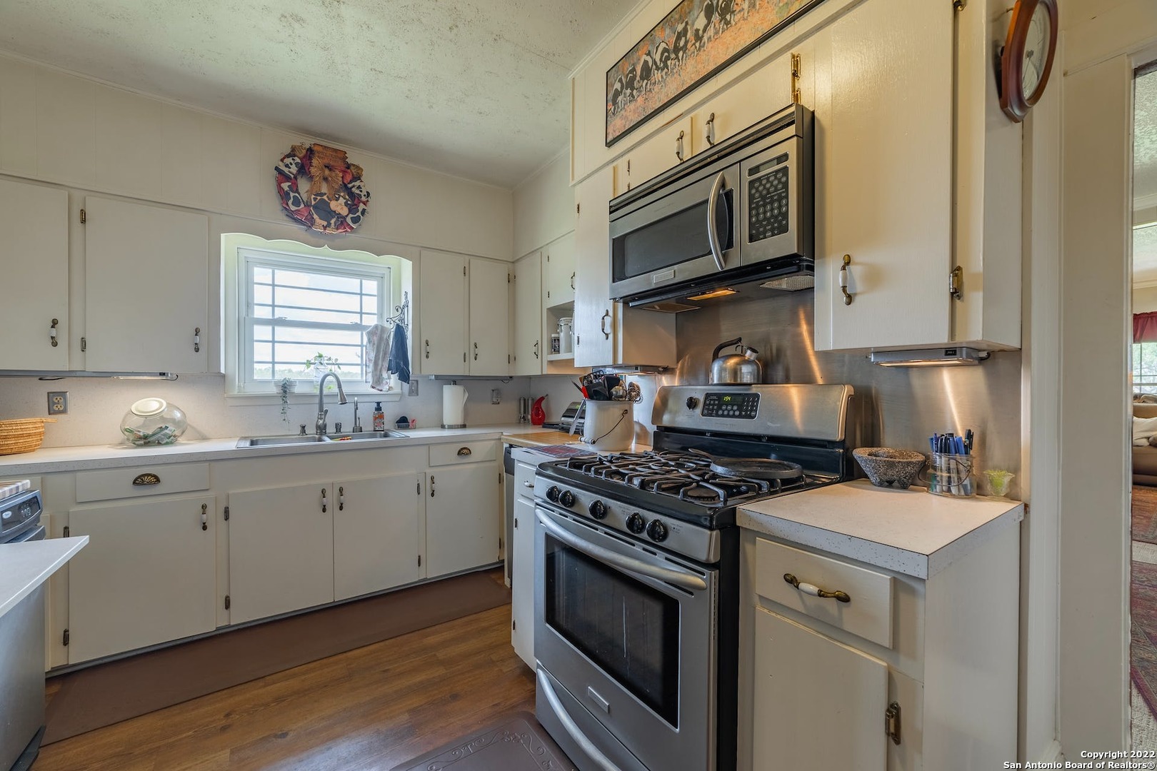 11801 Jim Terrill Road Adkins, TX 78101 - Photo 10 of 46 a kitchen with stainless steel appliances granite countertop a stove and a microwave