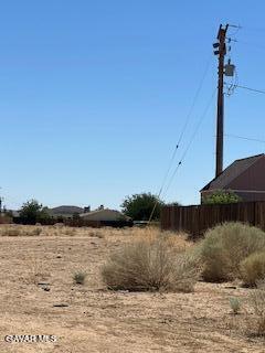 0 Neuralia Road Mojave, CA 93505 - Photo 2 of 4 a view of a lake with houses in background