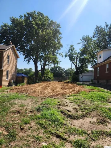 a view of backyard with green space
