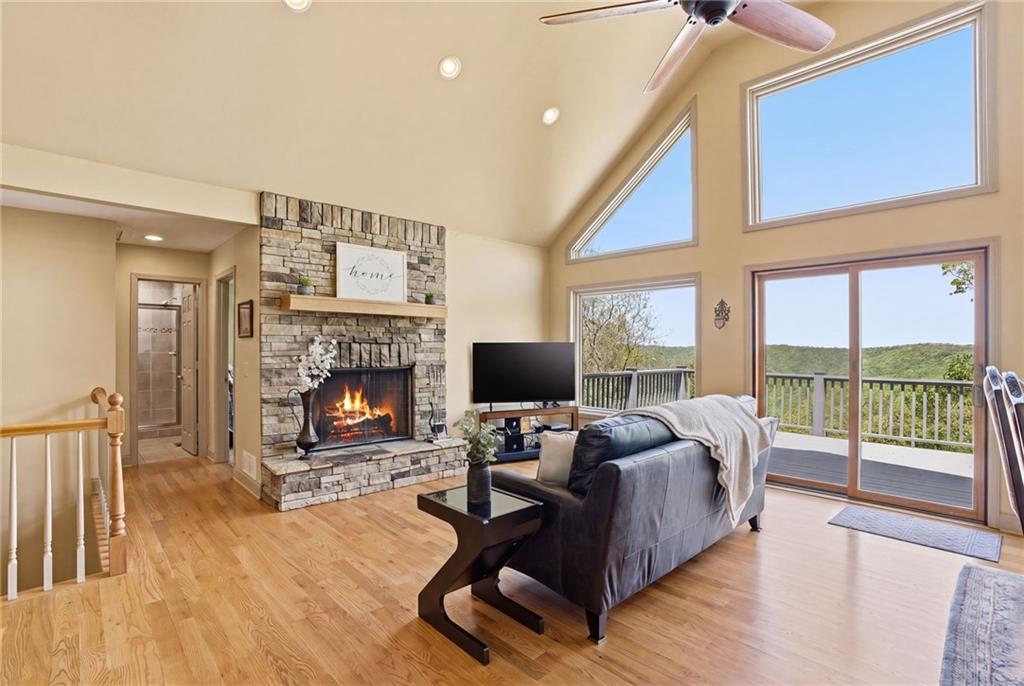 3326 Monument Road Jasper, GA 30143 - Photo 12 of 49 a living room with furniture a fireplace and a floor to ceiling window