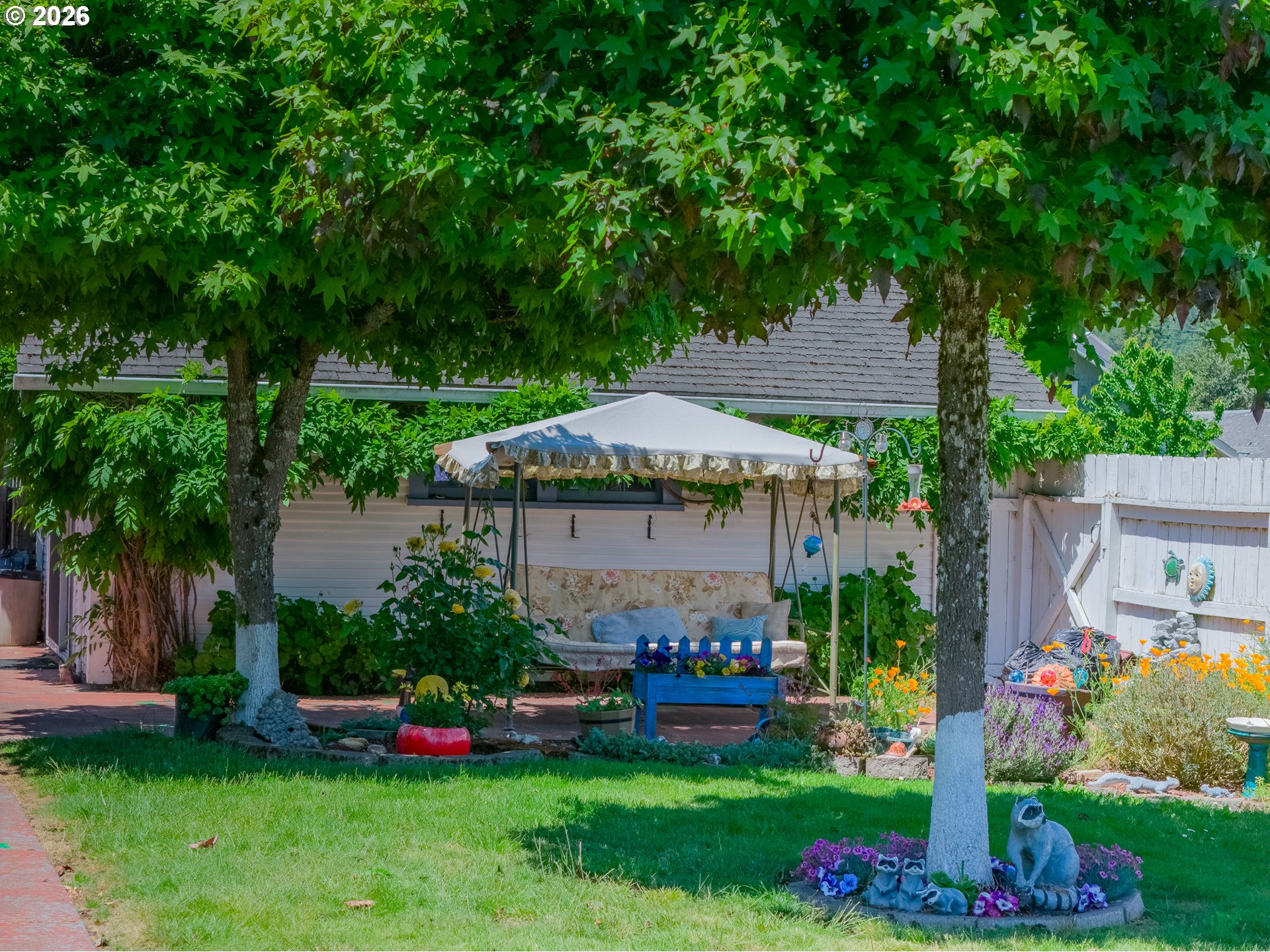 208 7th Street Myrtle Point, OR 97458 - Photo 13 of 48 a view of a house with backyard space and garden