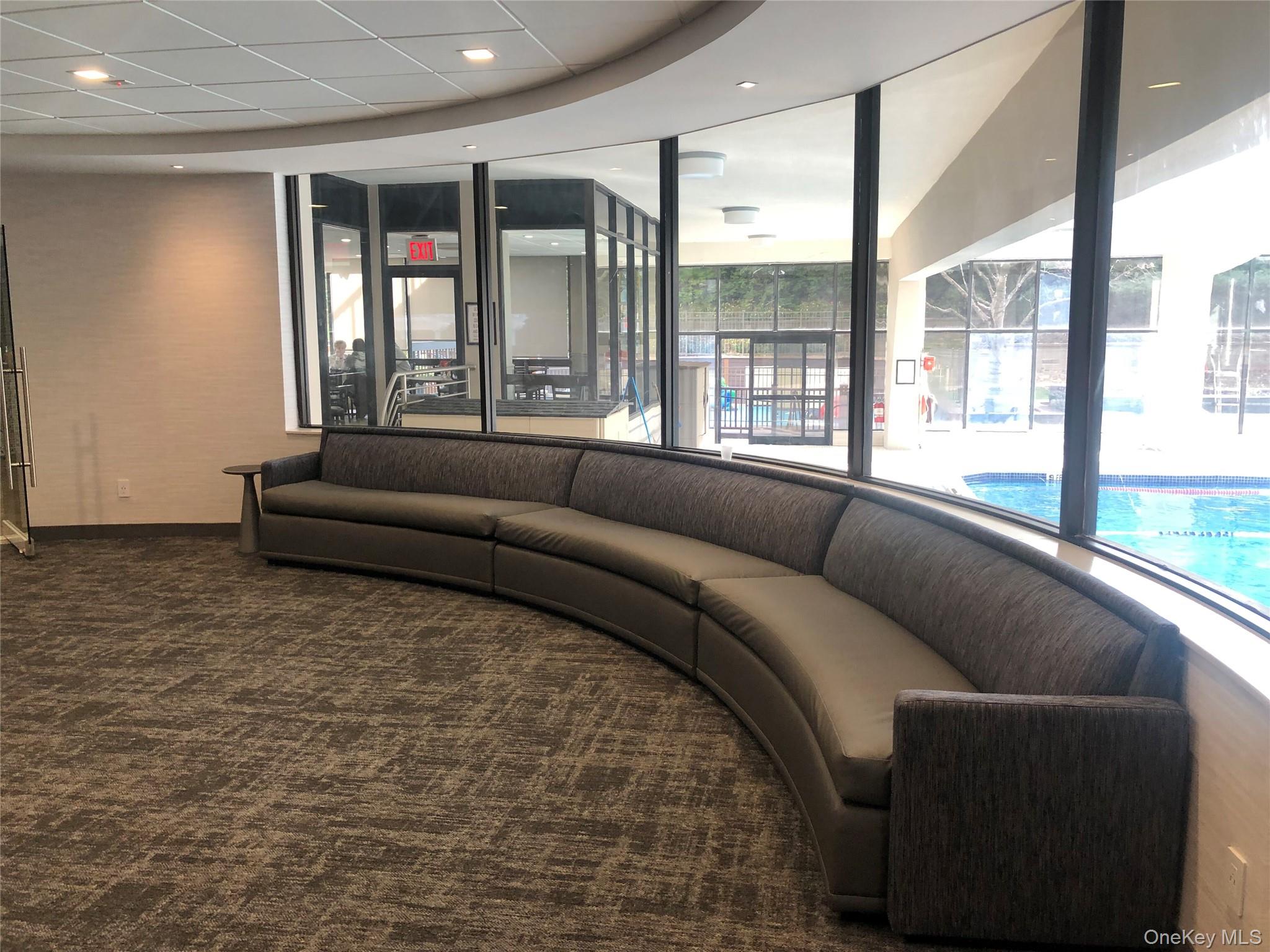 2 Bay Club Drive, Unit 16N Queens, NY 11360 - Photo 12 of 16 Seating area overlooking pool in Swim & Fitness center.