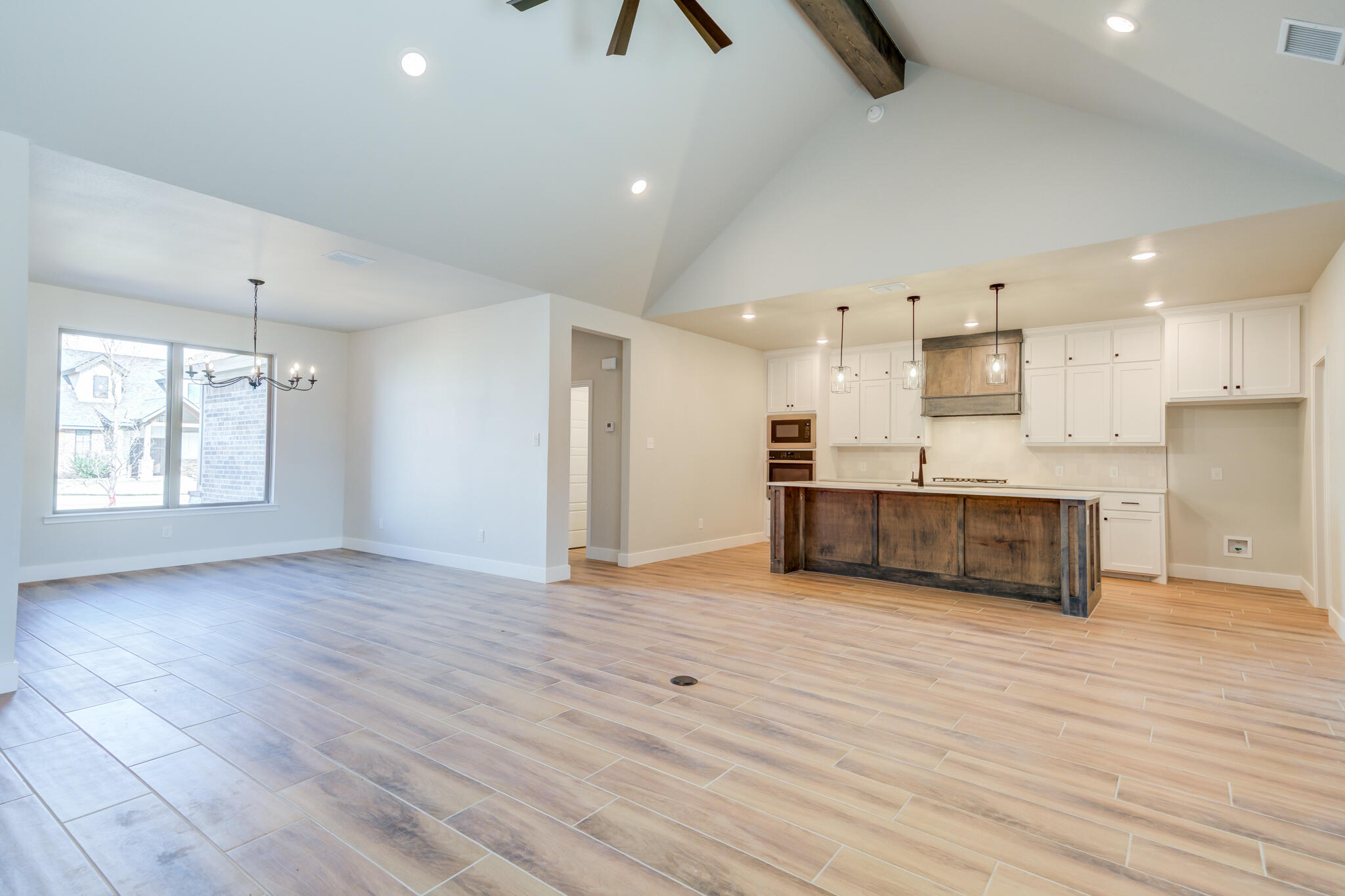 7805 54th Street Lubbock, TX 79407 - Photo 17 of 55 a view of kitchen with wooden floor and electronic appliances