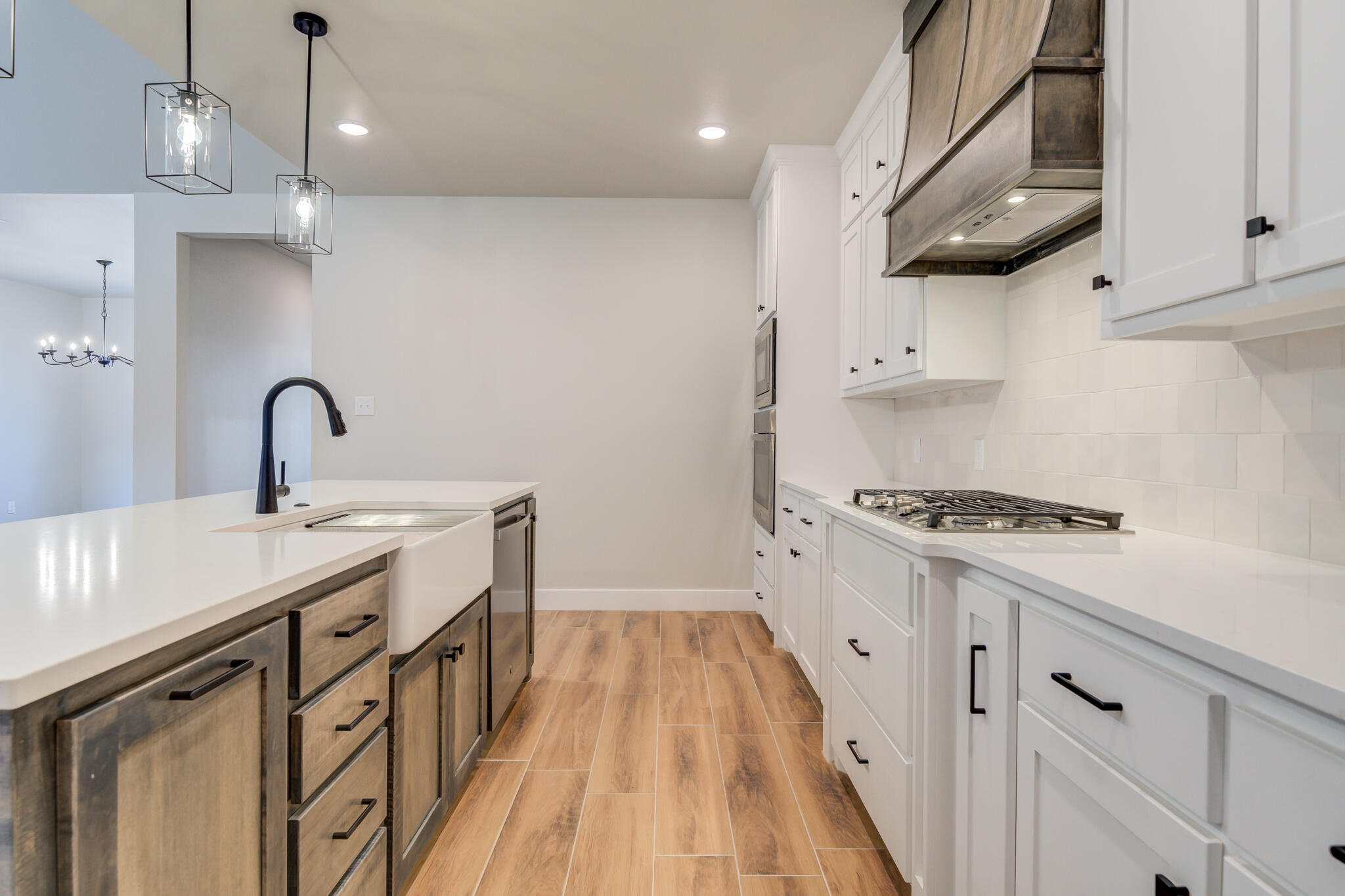 7805 54th Street Lubbock, TX 79407 - Photo 27 of 55 a kitchen with stainless steel appliances a sink a stove and a refrigerator