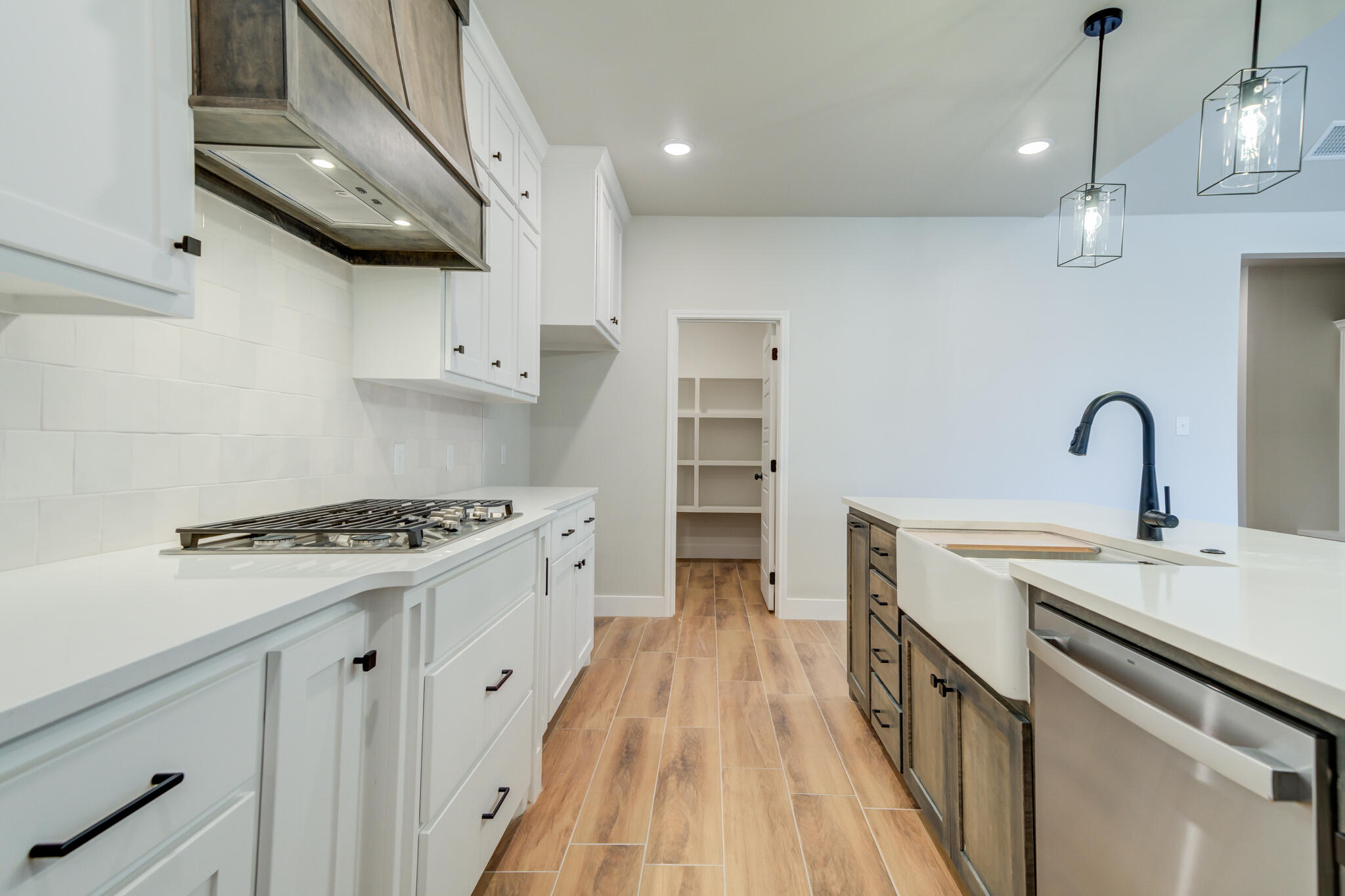 7805 54th Street Lubbock, TX 79407 - Photo 30 of 55 a kitchen with stainless steel appliances a sink stove and cabinets