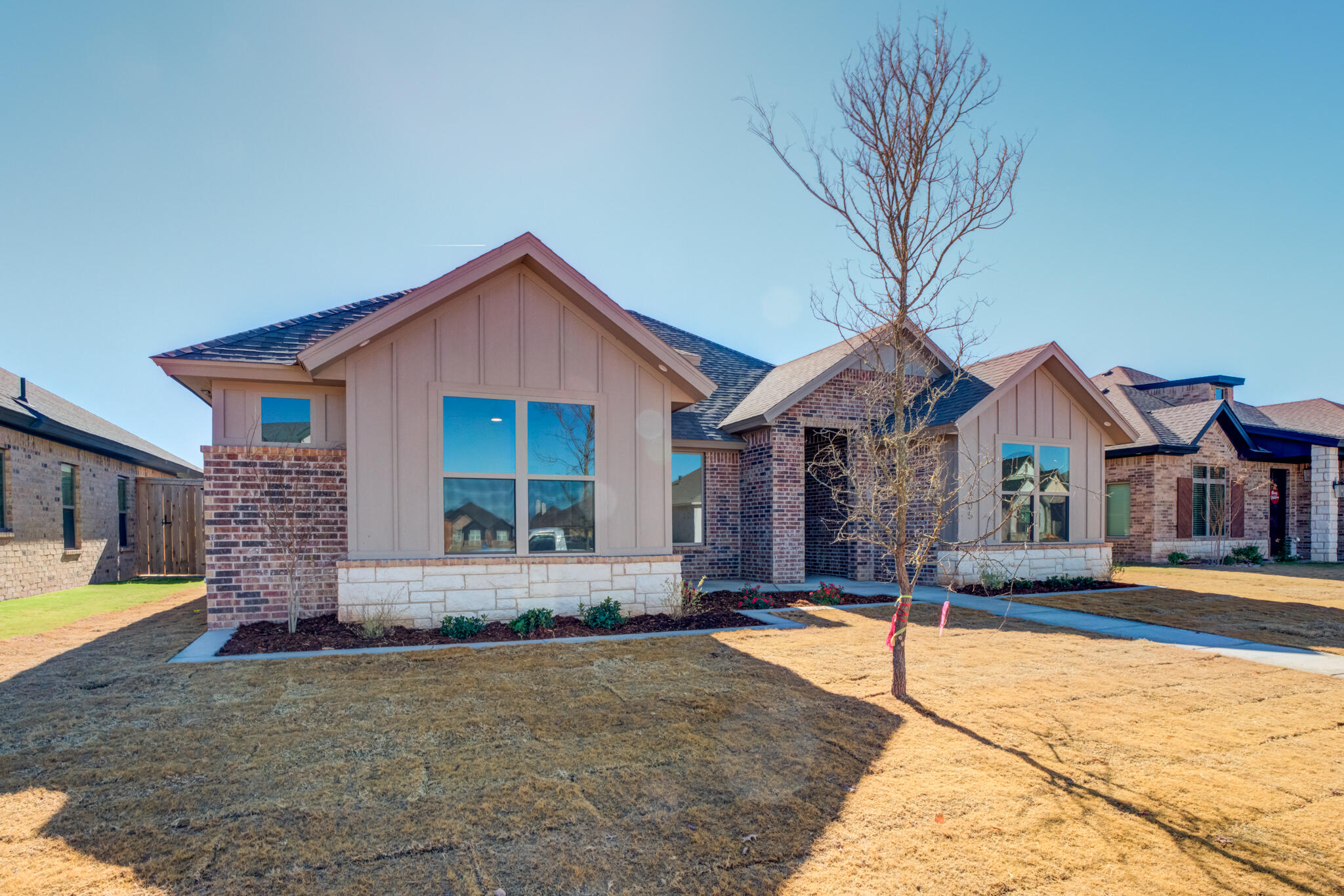 7805 54th Street Lubbock, TX 79407 - Photo 3 of 55 a front view of a house with a yard