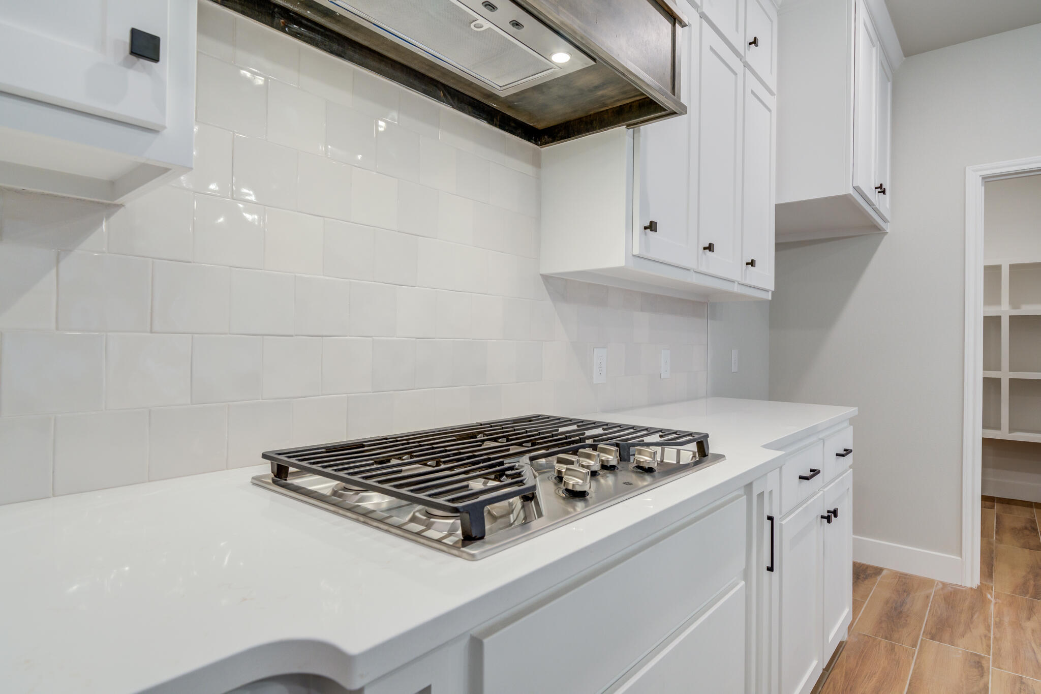 7805 54th Street Lubbock, TX 79407 - Photo 31 of 55 a white stove top oven sitting inside of a kitchen