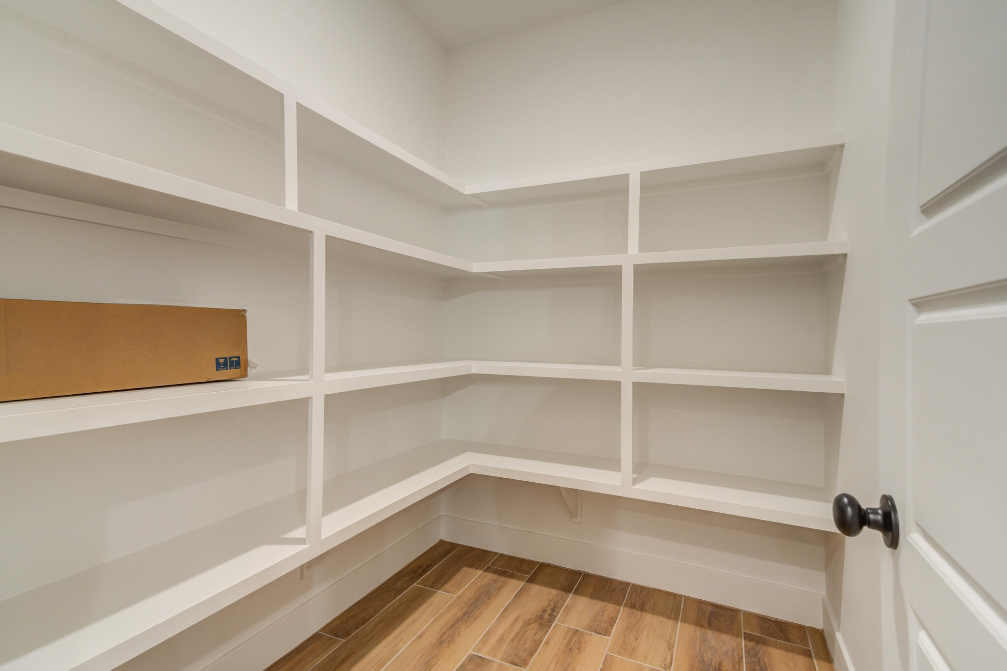 7805 54th Street Lubbock, TX 79407 - Photo 32 of 55 a view of walk in closet with empty racks