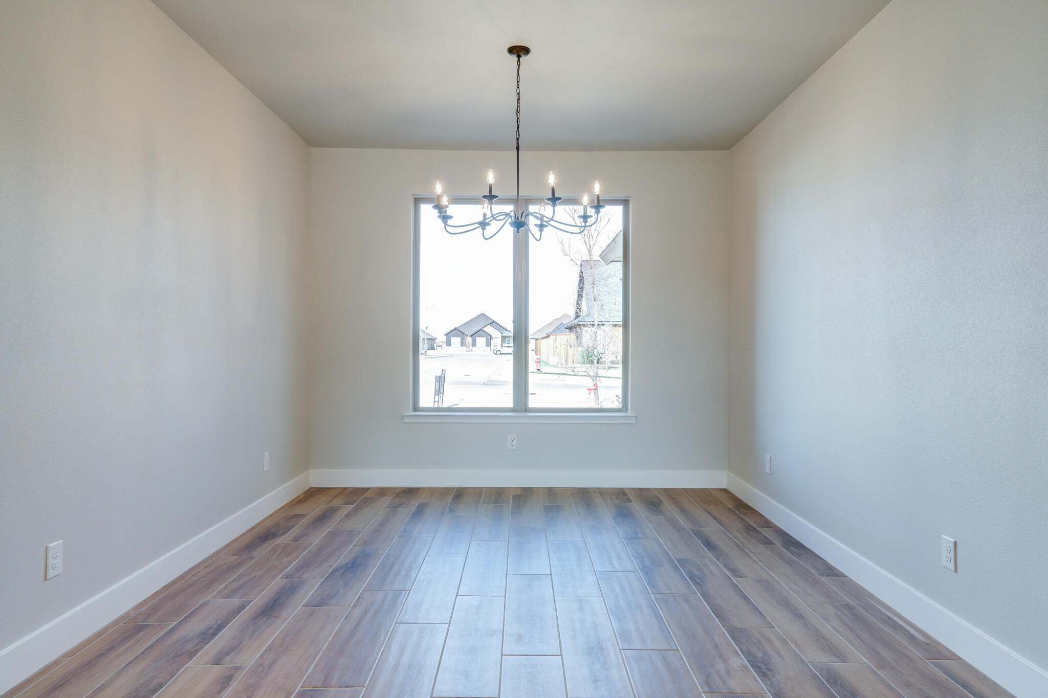 7805 54th Street Lubbock, TX 79407 - Photo 35 of 55 a view of a room with wooden floor outdoor space and window