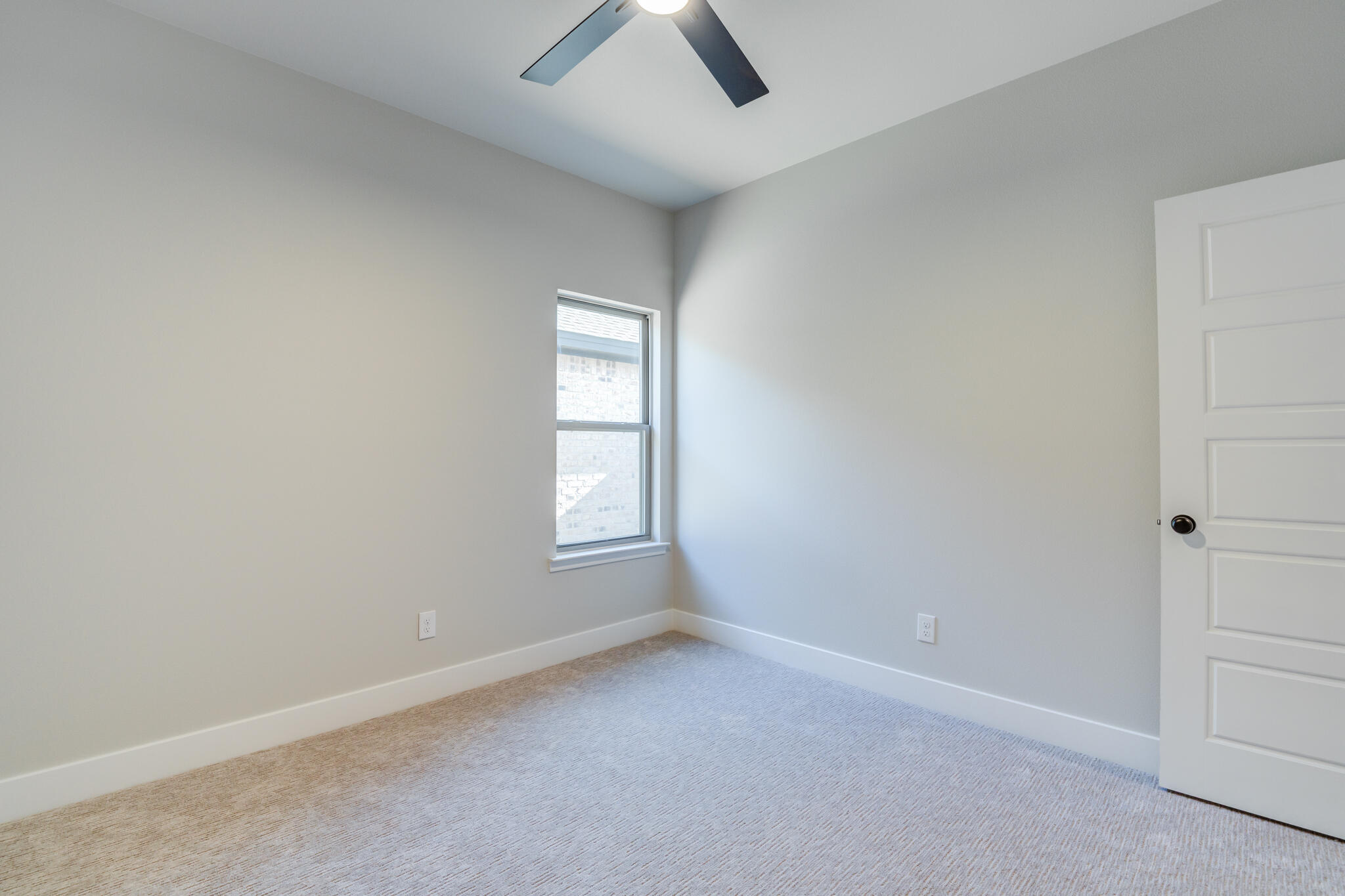 7805 54th Street Lubbock, TX 79407 - Photo 39 of 55 an empty room with chandelier fan and windows