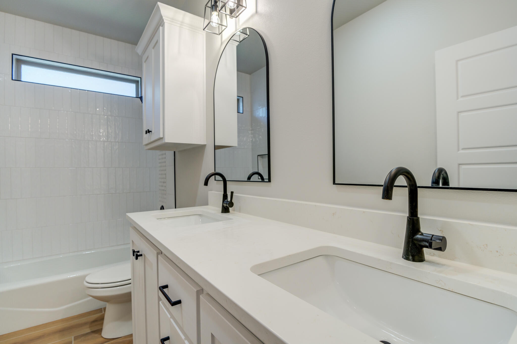 7805 54th Street Lubbock, TX 79407 - Photo 40 of 55 a bathroom with a sink and a mirror