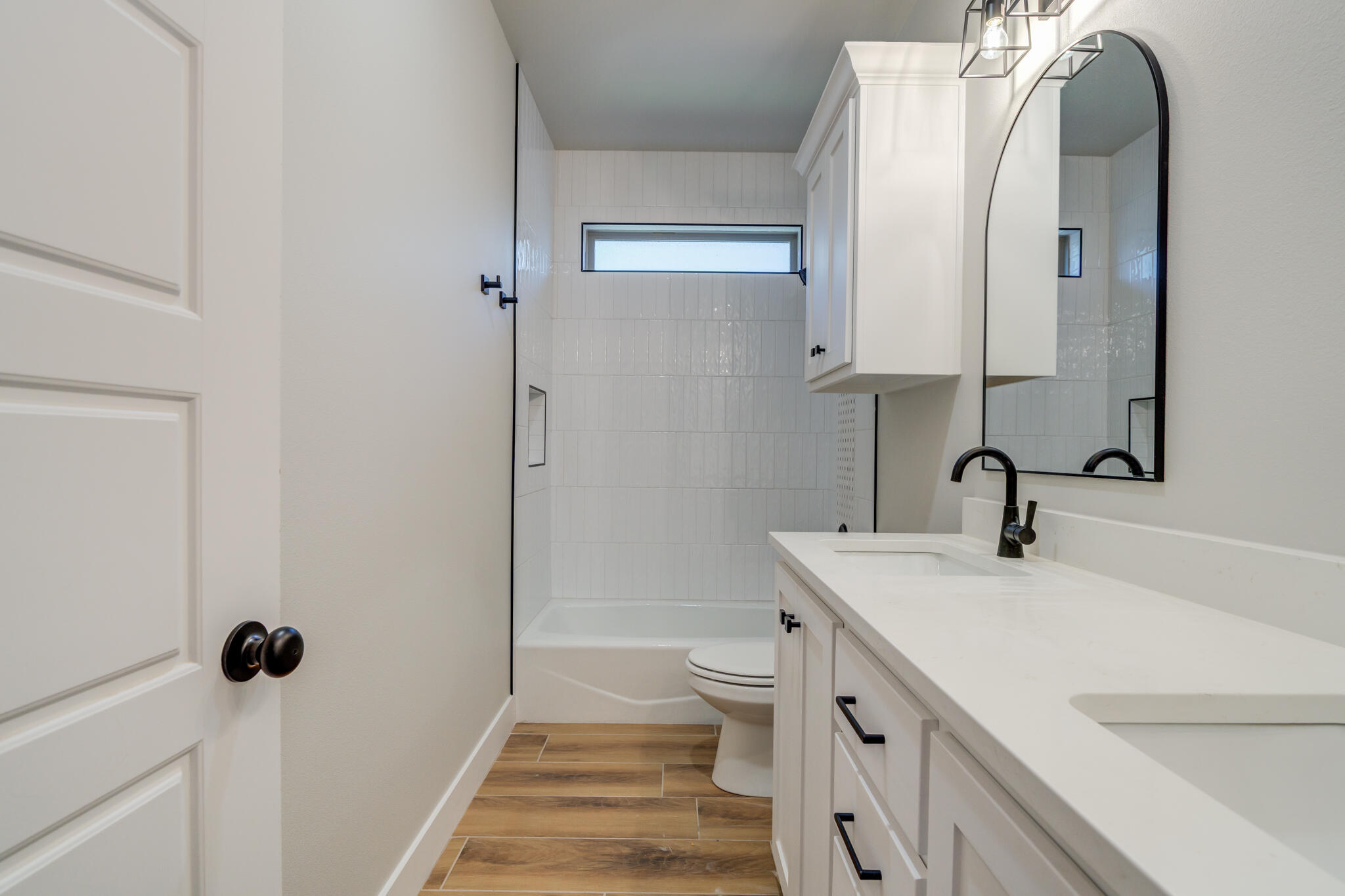 7805 54th Street Lubbock, TX 79407 - Photo 41 of 55 a bathroom with a sink and a mirror