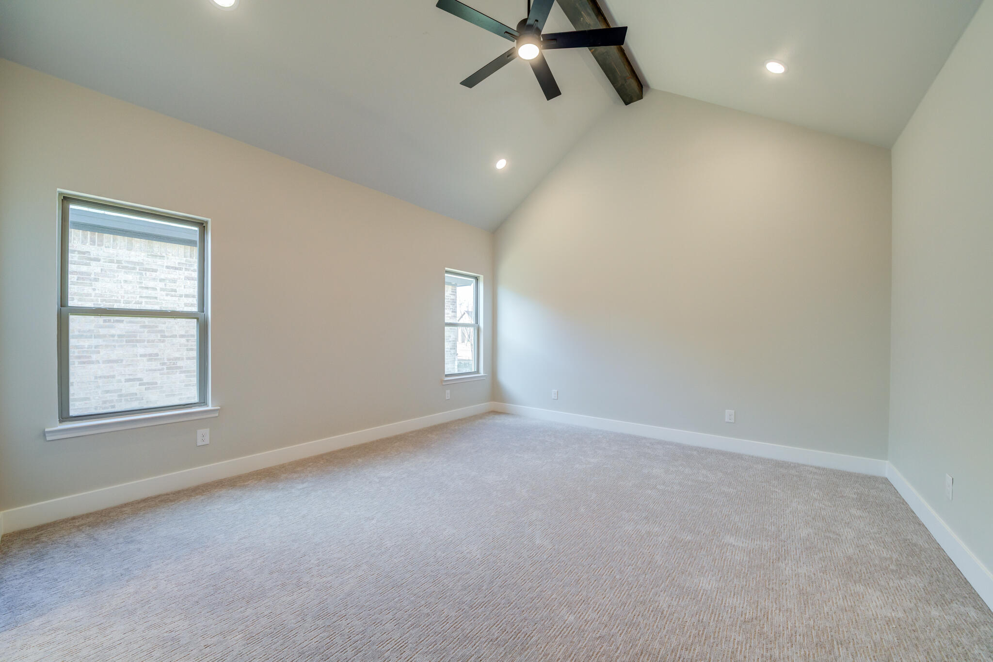 7805 54th Street Lubbock, TX 79407 - Photo 43 of 55 an empty room with windows and fan
