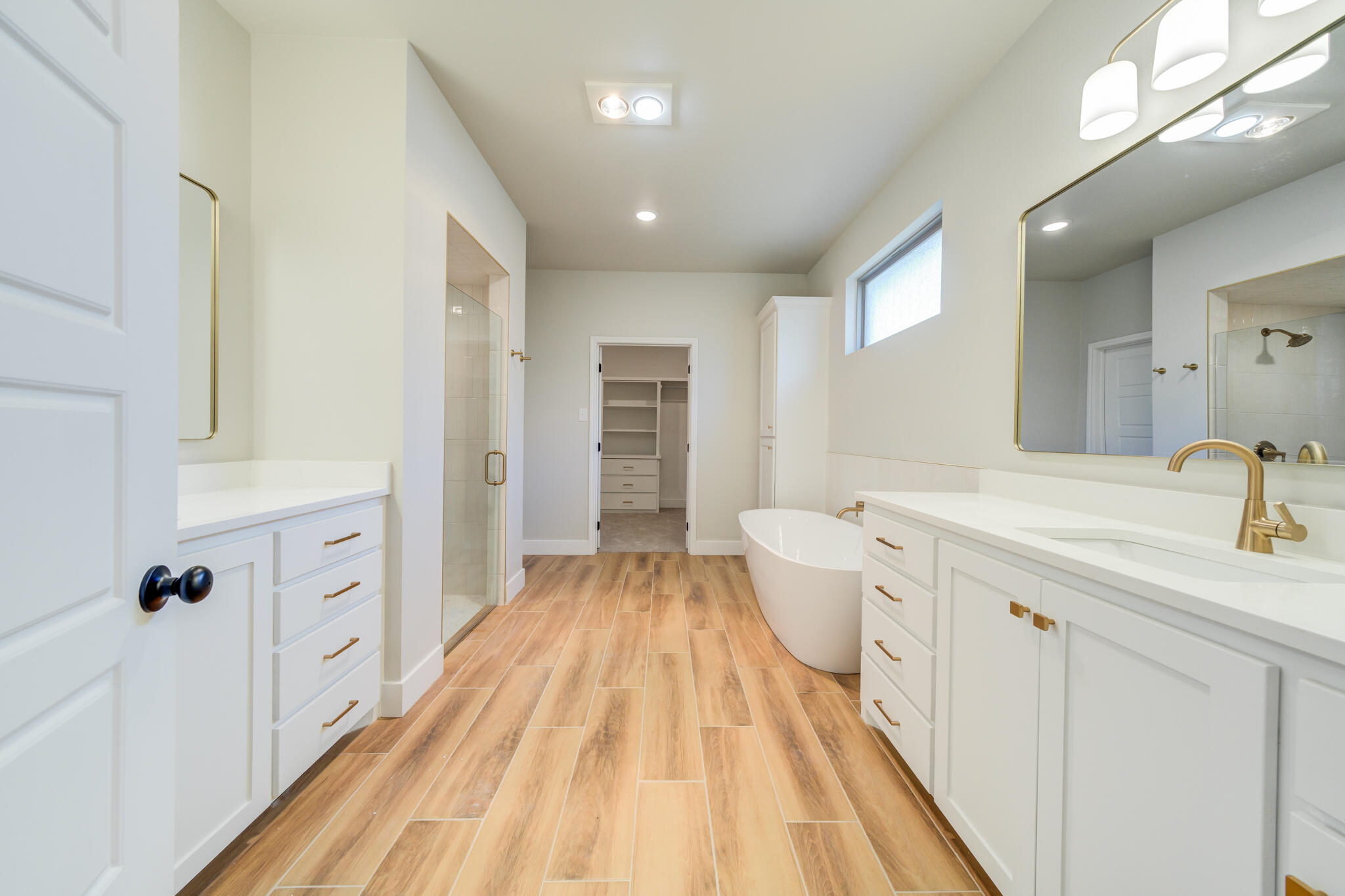 7805 54th Street Lubbock, TX 79407 - Photo 46 of 55 a spacious bathroom with a double vanity sink and a mirror