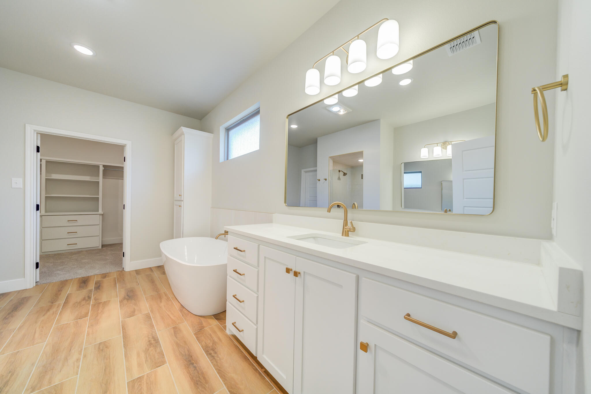 7805 54th Street Lubbock, TX 79407 - Photo 47 of 55 a spacious bathroom with a sink and a mirror