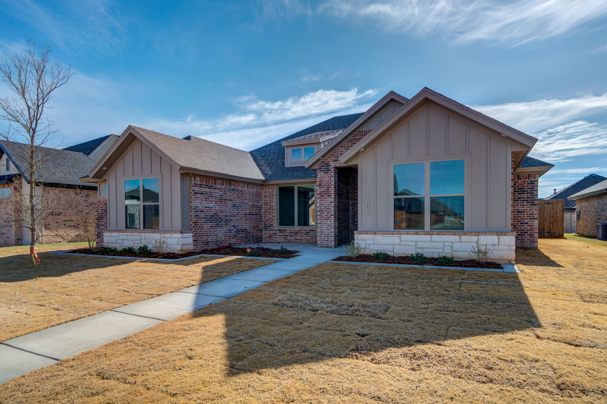 7805 54th Street Lubbock, TX 79407 - Photo 5 of 55 a view of a house with a yard