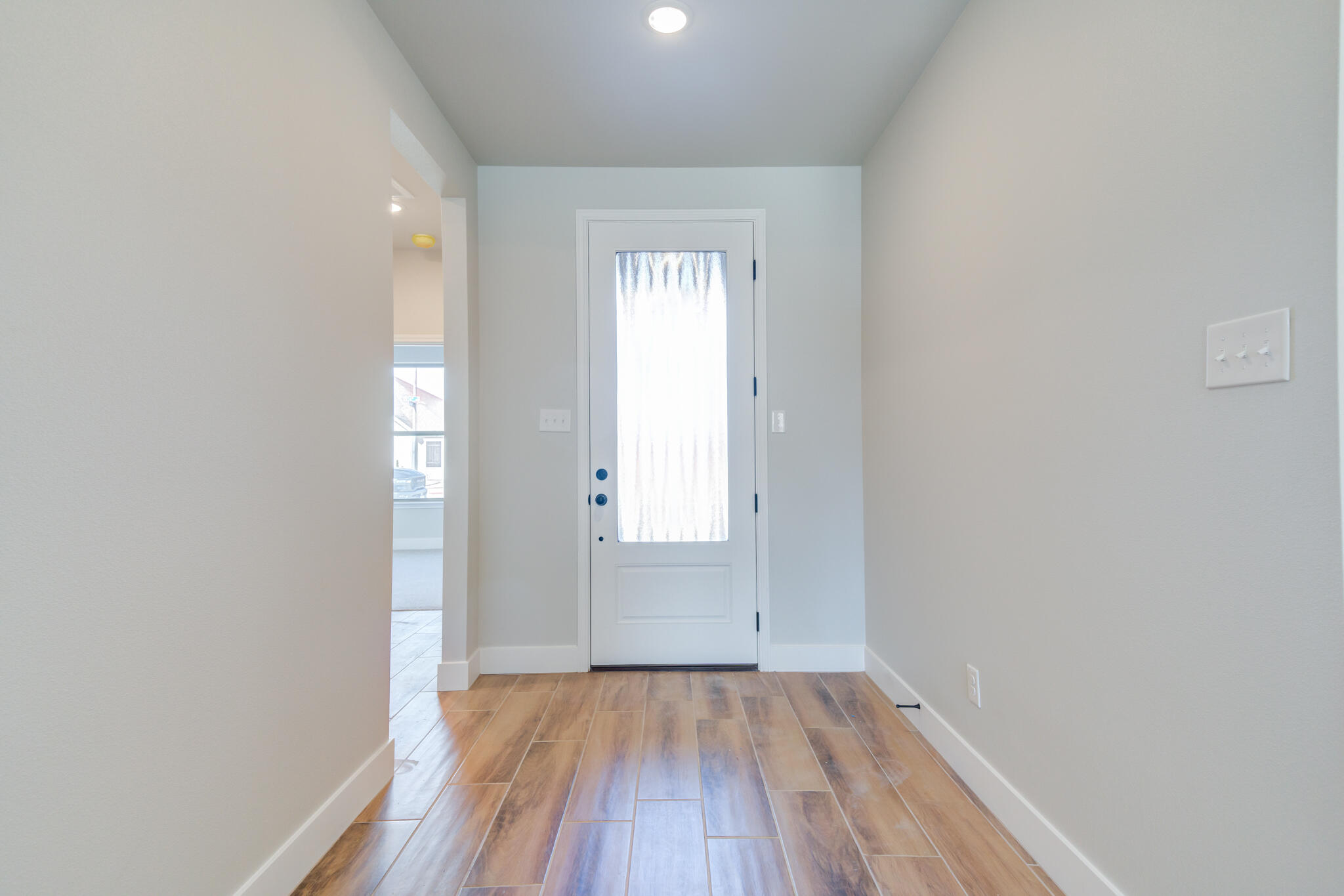 7805 54th Street Lubbock, TX 79407 - Photo 8 of 55 a view of a room with wooden floor and window