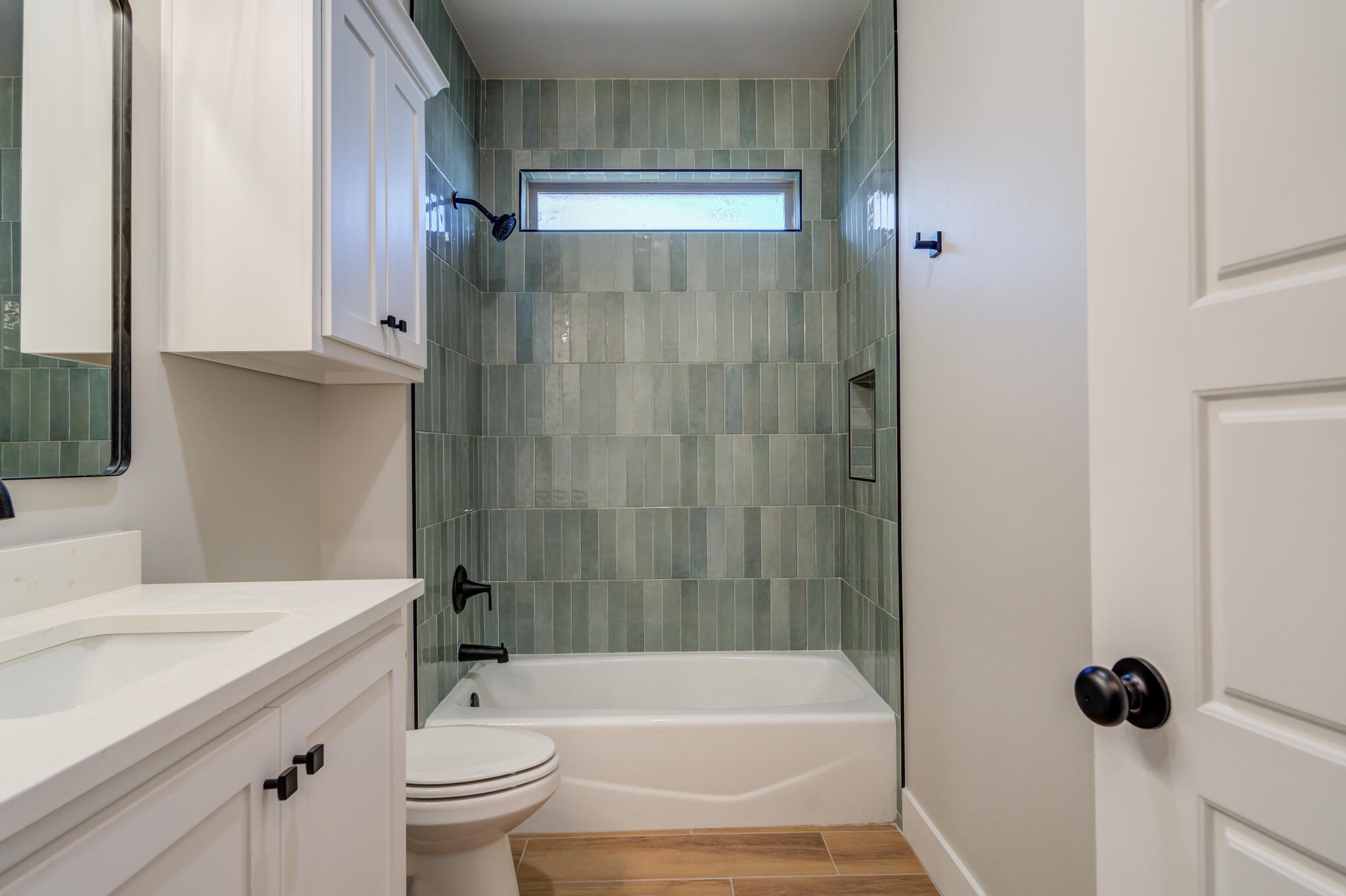 7805 54th Street Lubbock, TX 79407 - Photo 9 of 55 a bathroom with a sink a toilet and shower