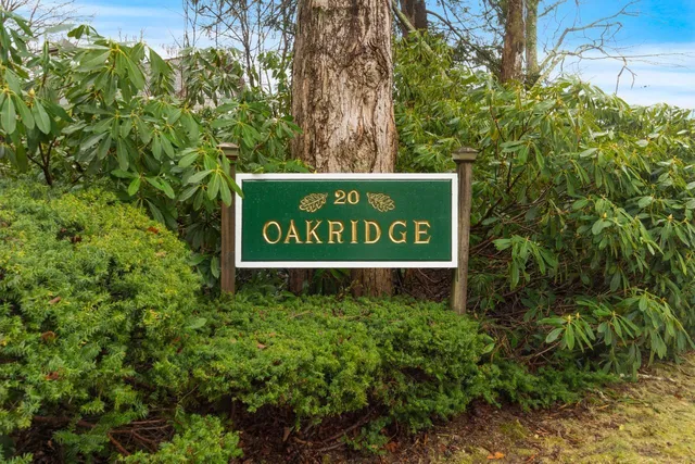 a sign that is sitting in front of flowers
