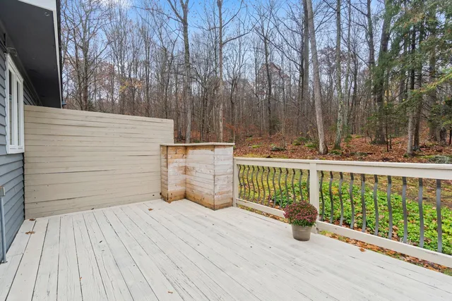 a view of a wooden deck with a trees