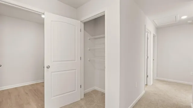 a view of a hallway with closet
