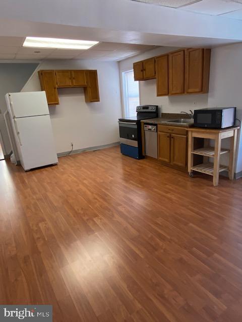 a kitchen with stainless steel appliances granite countertop a stove and a sink