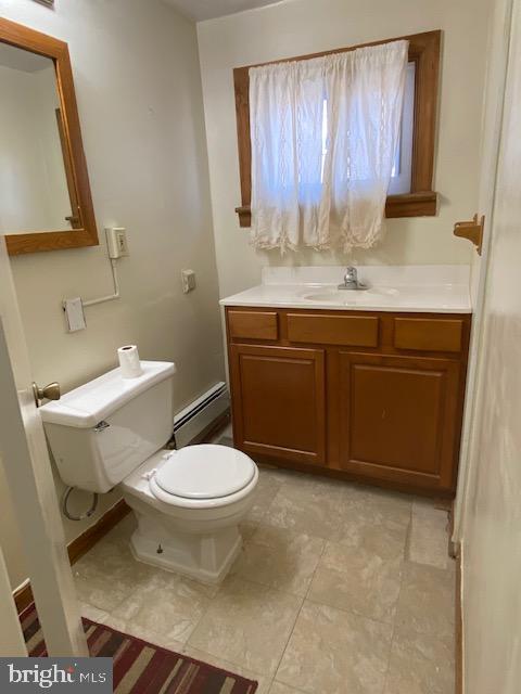 300 East Fort Avenue Baltimore, MD 21230 - Photo 4 of 14 a bathroom with a granite countertop toilet sink and mirror
